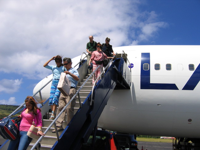 Passengers exiting airplane