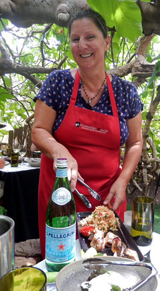 Fig Tree Restaurant owner Sasha Sachs serves salad