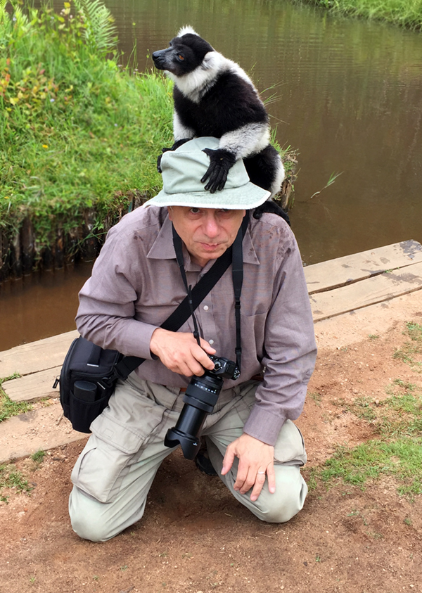 Lemur sitting on Alex Shaland's head