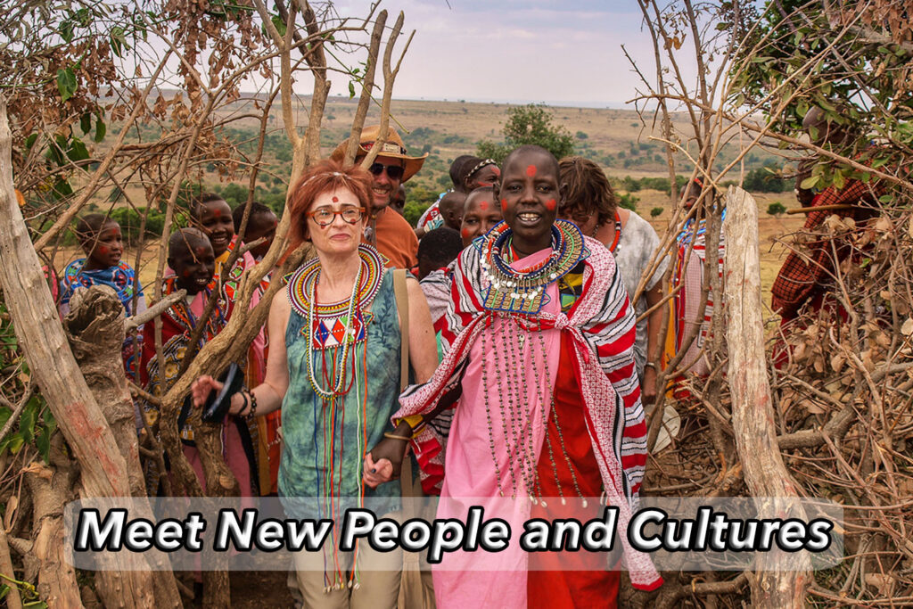Irene Shaland enters Masai village surrounded by Masai Women